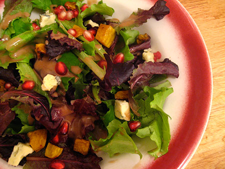 Fall Salad with pomegranate seeds, cashel blue and roasted golden beets